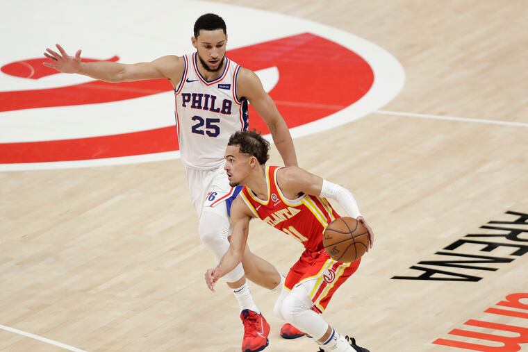 Sixers guard Ben Simmons defends Atlanta Hawks guard Trae Young during Game 3 of the NBA Eastern Conference playoff semifinals on Friday, June 11, 2021 in Atlanta.