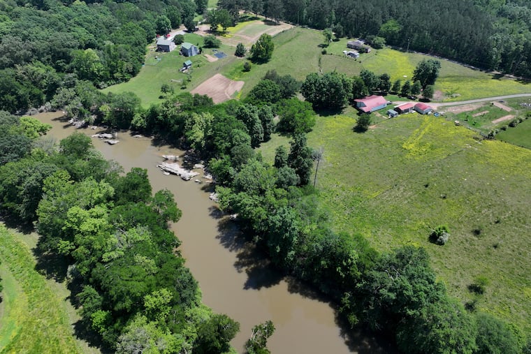 Faye Jackson has lived for decades on a patch of rural land (right) in Resaca, Ga., on the banks of the Conasauga River last May.