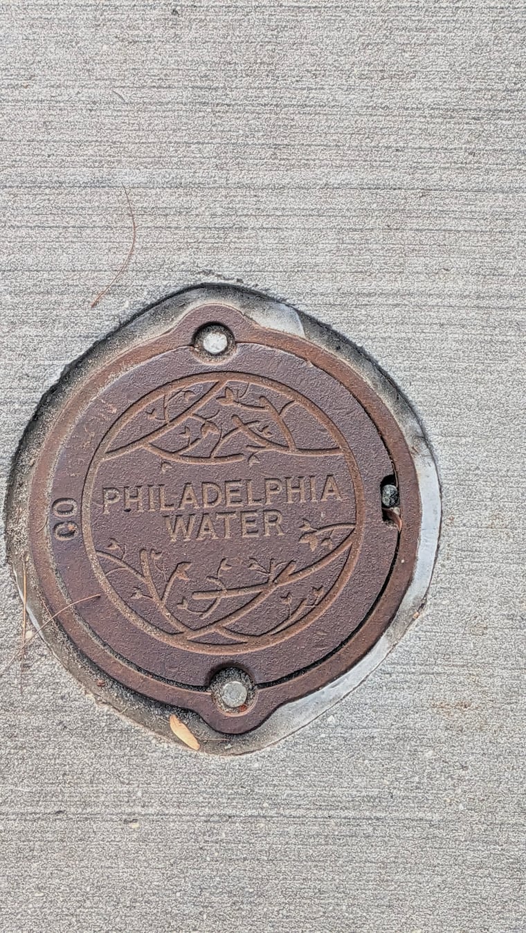 A Philadelphia Water Department metal manhole cover on the John F. Kennedy Boulevard Bridge. Taken on Sept. 17 2026.