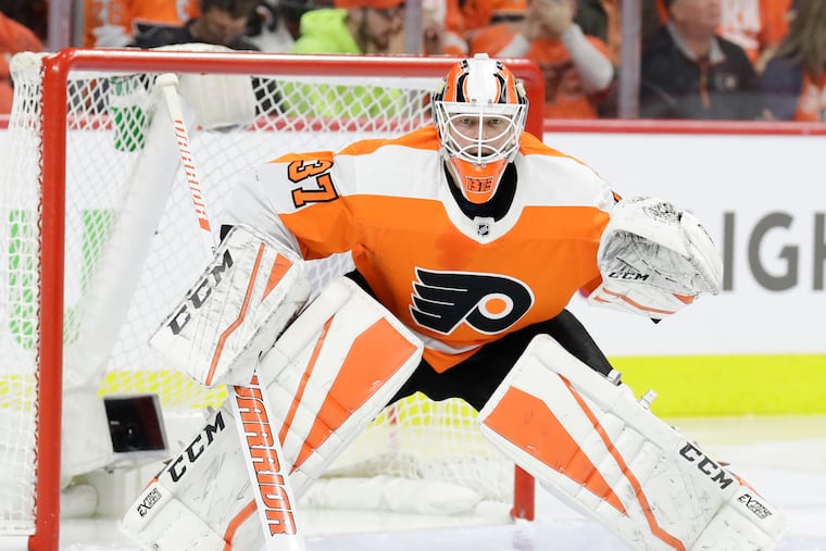 Flyers goaltender Brian Elliott in front of his goal against the Pittsburgh Penguins in game three of the Eastern Conference quarterfinal playoffs on Sunday, April 15, 2018 in Philadelphia. YONG KIM / Staff Photographer