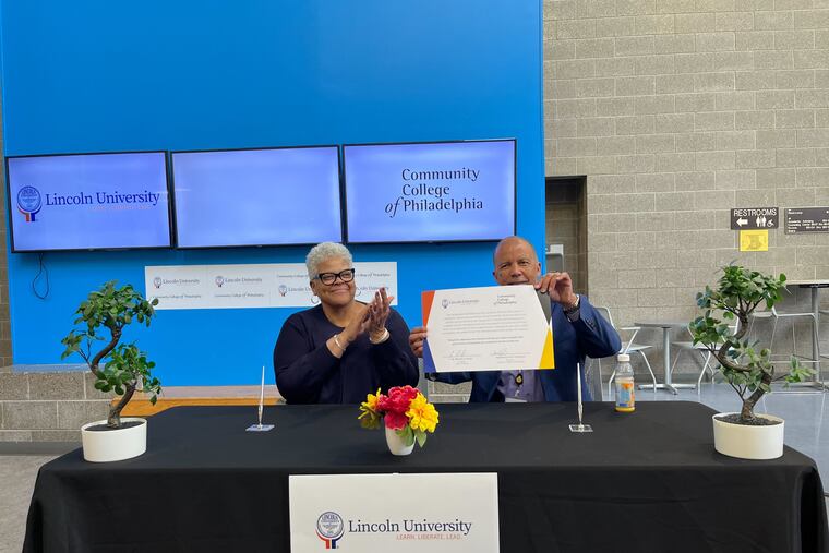 Brenda A. Allen (left), president of Lincoln University, and Donald Guy Generals, president of the Community College of Philadelphia, signing a partnership agreement to create a pathway for Lincoln grads into CCP's accelerated nursing program.