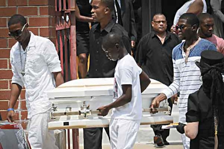 A casket of one of Samara Banks' three children is carried from Deliverance Evangelistic Church in North Philadelphia after funeral proceedings for her and her three children, who were killed last week in an accident on Roosevelt Boulevard. ( RON TARVER / Staff Photographer )