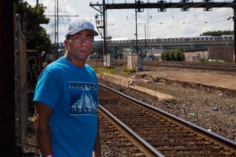 Jose Colon at the train tracks at Sedgley and Castor Avenues on Monday, July 24, 2017. His teenage stepson lost a leg last week in an accident on the tracks.