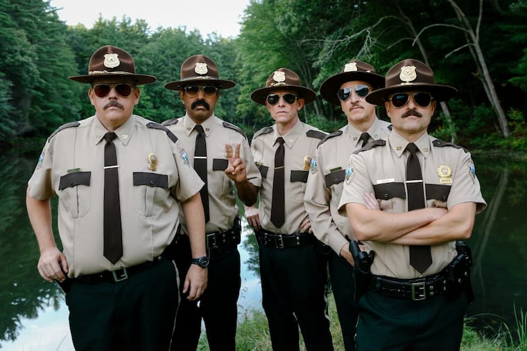 (From L-R): Kevin Heffernan as "Farva," Jay Chandrasekhar as "Thorny," Erik Stolhanske as "Rabbit," Paul Soter as "Foster," and Steve Lemme as "Mac" in the film Super Troopers 2.