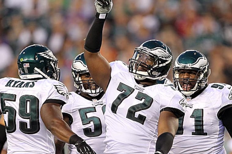 The Eagles' Cedric Thornton celebrates a tackle with teammates DeMeco Ryans, Trent Cole and Fletcher Cox. (Yong Kim/Staff Photographer)