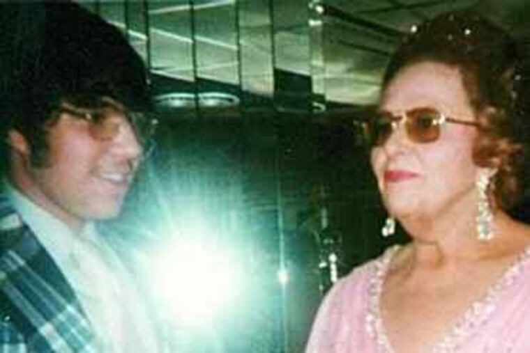 Amy Pohl, back in the house after her nervous/superstitious exile, snapped her clan (above, left) at an obviously terrific moment. Super-fan Ralph Manoppello was 15 when he met Kate Smith (above); now his daughters (left) Krista (wearing Gagne 12) and Kellie (in Carter 17) are as Flyered-up as he is.