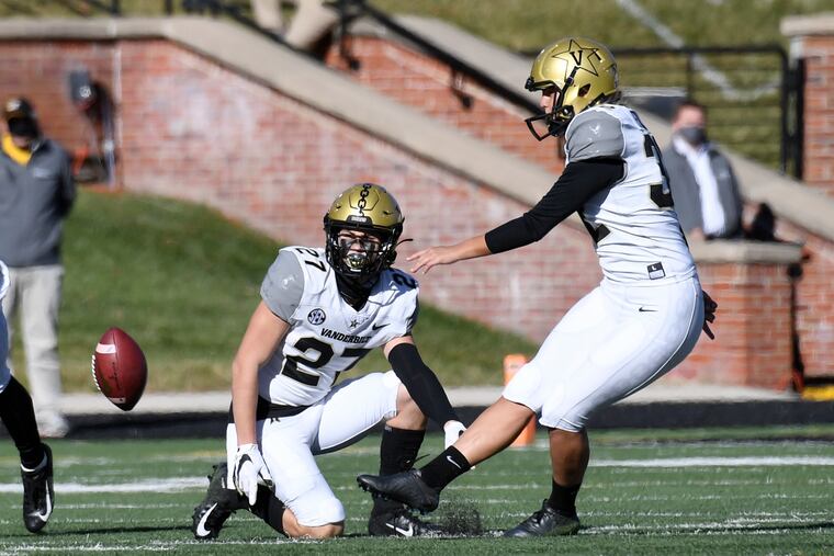 Vanderbilt's Sarah Fuller (right) kicks off as Ryan McCord (27) holds to start the second half against Missouri on Saturday.
