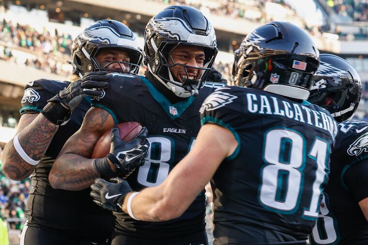 Eagles tight end E.J. Jenkins celebrates a touchdown with tight end Grant Calcaterra (right) during the fourth quarter Sunday, Jan. 5, 2025, in Philadelphia.