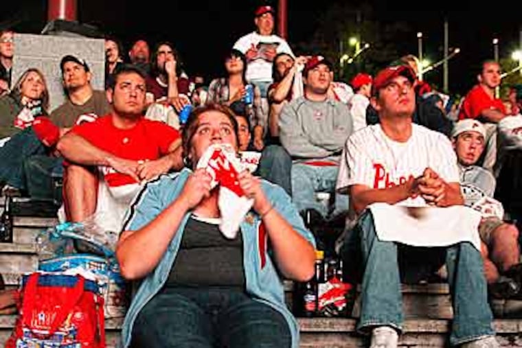 Michelle Aguero watches the Phillies vs the Dodgers
at the Phillies Rally on Penn's Landing on Sunday. (Rachel
Playe / Staff Photographer)