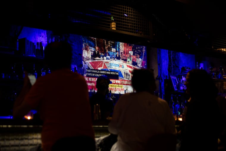 People watch election results come in during a watch party for Malcolm Kenyatta, candidate for Auditor General, at the Divine Lorraine on Election Day, Tuesday, Nov. 5, 2024, in Philadelphia.