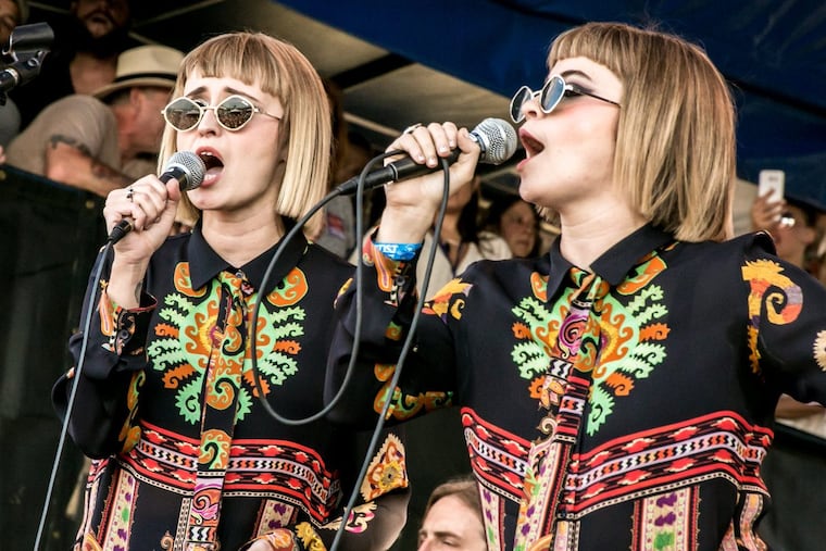 Jess Wolfe and Holly Laessig of Lucius at the Newport Folk Festival last month. They will perform with Roger Waters on his Us & Them Tour at the Wells Fargo Center in South Philadelphia this week.