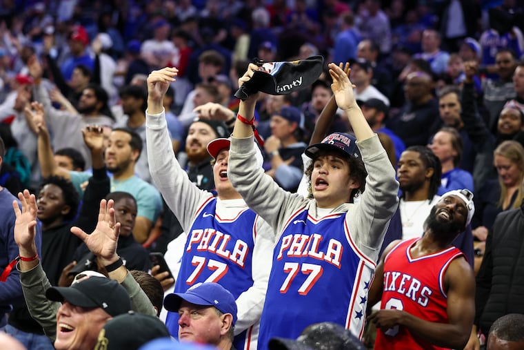 Sixers fans cheer during a T-shirt toss during the fourth quarter of Game 6.