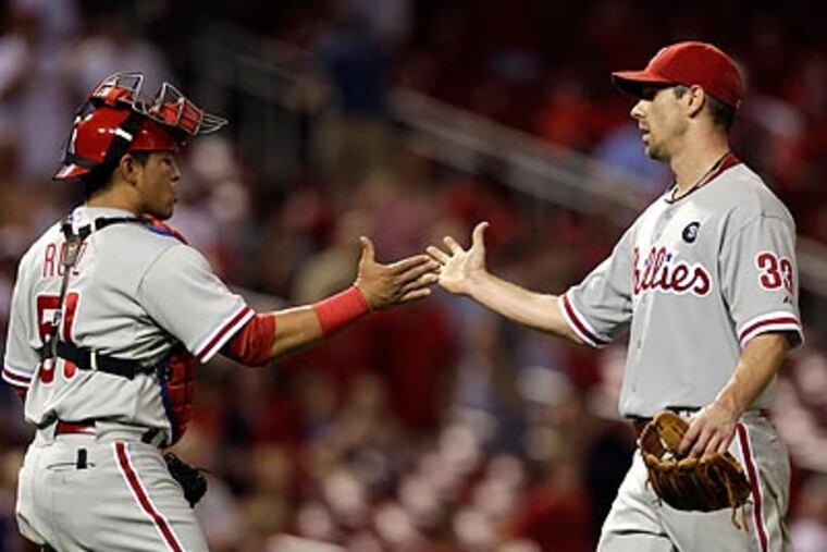 Cliff Lee and Carlos Ruiz celebrate after the final out of the Phillies' win. (Jeff Roberson/AP)