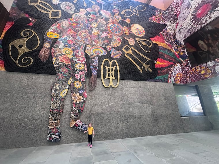 The author's daughter stands by a Nick Cave piece at The Princeton University Art Museum.