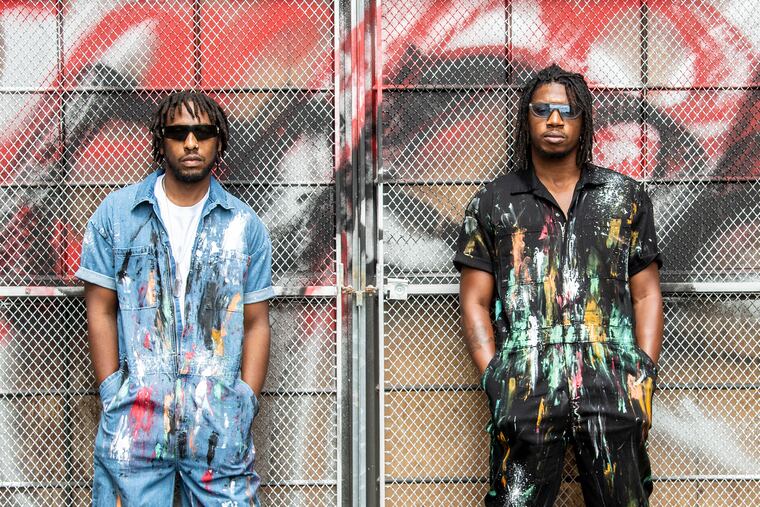 Jeantrix owners, Muhammad Abdul-Basit, left, and Deric Crawley, pose for a photo with Jeantrix outfits. Jeantrix, a local fashion brand, had pieces in Beyoncé’s newest visual album, "Black Is King."
