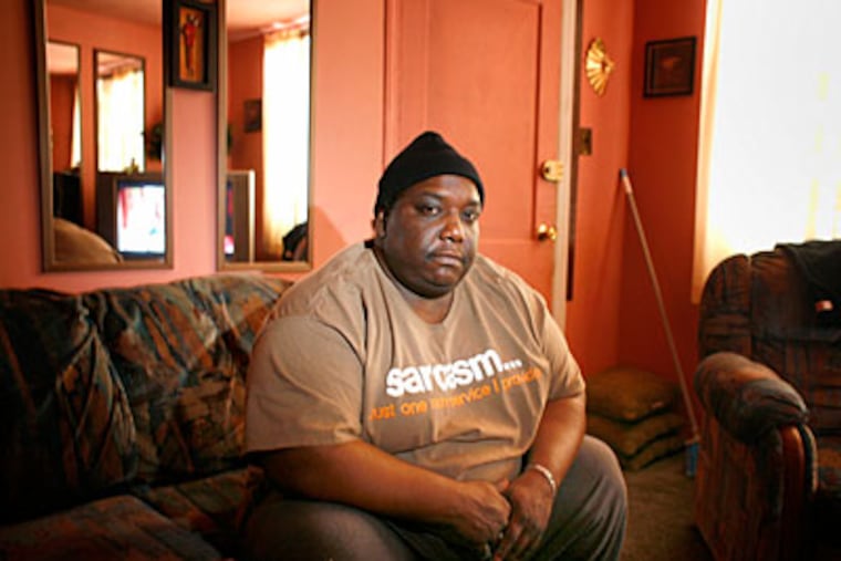 Camden police accused Ron Mills of running away from a raid. Mills says he walks with a cane and weighed 325 pounds at the time. “I’m so quick, I ran away,” he said sarcastically. (ED HILLE / Staff Photographer)