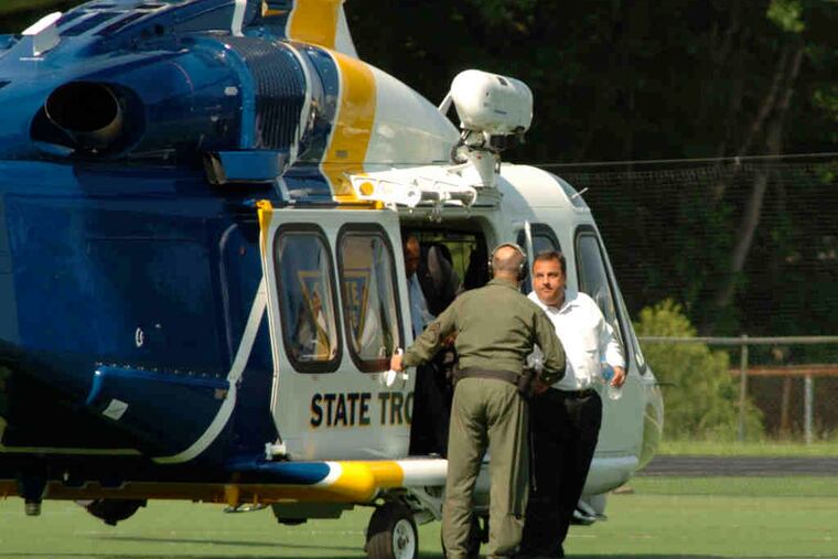 Gov. Christie arrives via state police helicopter in Montvale, N.J., to watch his son play baseball in high school playoffs. Christie left the game Tuesday to meet Iowa fund-raisers. Critics blasted him as an elitist hypocrite.