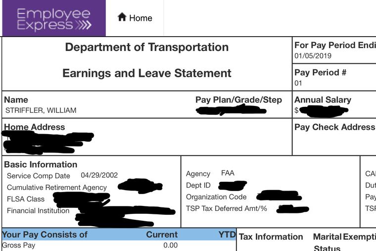This portion of Bill Striffler's electronic pay stub provided by him to the Associated Press on Friday, Jan. 11, 2019, with portions blacked out by him, shows his recent pay to be $0.00 for his work as an air traffic controller at Newark Airport. Some 800,000 federal employees, more than half still on the job, were due to miss their first paycheck Friday under a partial government shutdown as President Donald Trump and Congress remain at odds over funding for his long-promised U.S.-Mexico border wall. (Bill Striffler via AP)