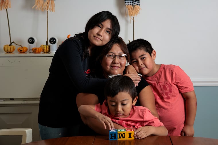 Left to right, Melany Merida, 13, Gimena Morales Antezana, Jair Merida, 5, and Matias Merida, 7, posed for a portrait at their home in October in Philadelphia. Gimena’s husband, Johny Merida Aguilar, has decided to accept deportation after being arrested by ICE in September.