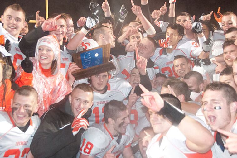 Cherokee players celebrate their winning the Group 5
Championship. )Photo/Curt Hudson)