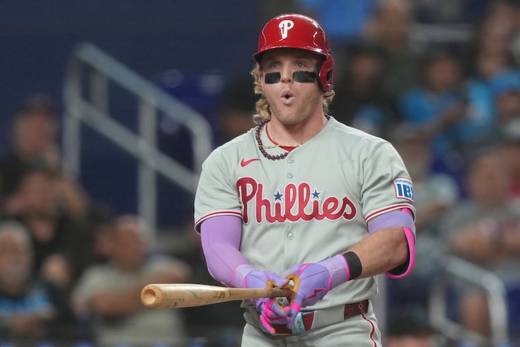 Philadelphia Phillies outfielder Harrison Bader reacts after striking out during the fifth inning of a baseball game against the Miami Marlins Friday, in Miami. Bader hit a home run in the stands in the fourth inning.