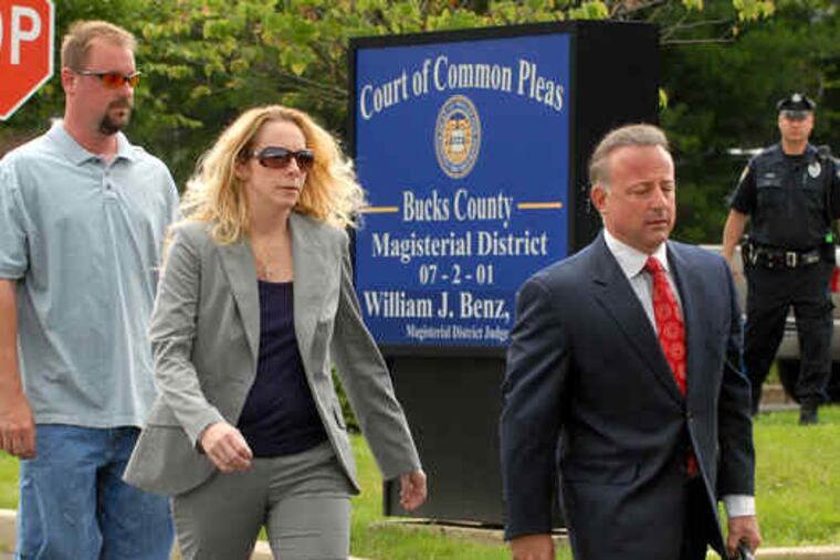 Bonnie Sweeten arrives at District Court in Richboro for a preliminary hearing. She was accompanied by her husband, Larry (left), and lawyer Louis Busico. The Bucks County woman whose kidnapping hoax causeda national media frenzy in May waived yesterday's hearing. Story, B3.