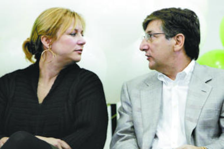 Danielle and Vahan H. Gureghian announce their $400,000 donation for school laptops. His firm runs the charter, which spent 44.6 percent of its money on administration and business in 2006-07.