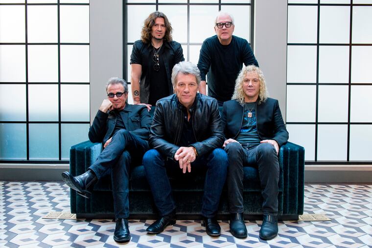 In this Oct. 19, 2016 file photo, members of Bon Jovi front row from left, Tico Torres, Jon Bon Jovi, David Bryan, back row from left, Phil X, and Hugh McDonald pose for a portrait in promotion of their album "This House is Not for Sale" in New York.