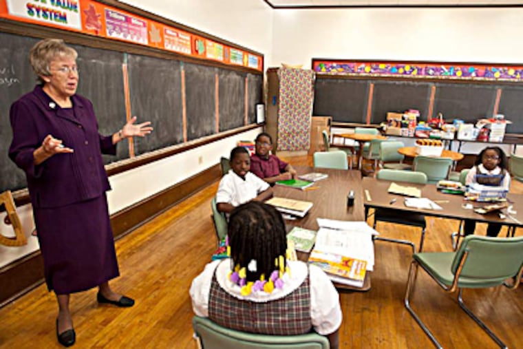 Sis. Nancy Fitzgerald, principal of St. Martin de Porres Catholic elementary school, talks to students in the newly renovated school. (Ron Tarver / Staff Photographer )