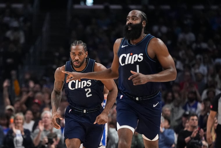 Los Angeles Clippers forward Kawhi Leonard (2) and guard James Harden make their way downcourt during the first half against the Sixers.