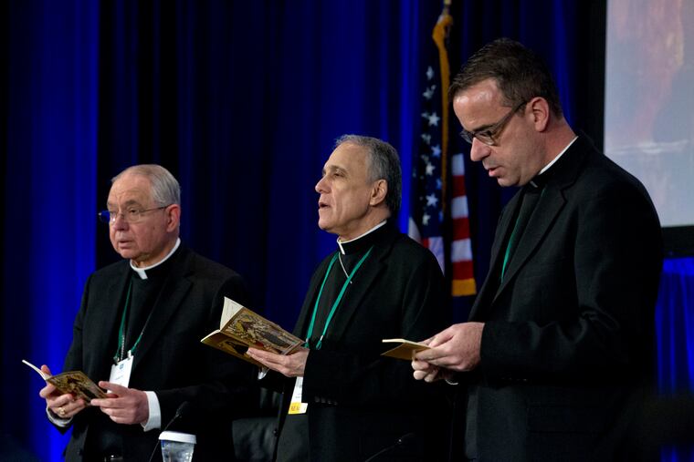 From left, Jose Gomez, archbishop of Los Angeles; Cardinal Daniel DiNardo, archbishop of Galveston-Houston and president of the United States Conference of Catholic Bishops; and Msgr. J. Brian Bransfield participates in a morning prayer during the U.S. Conference of Catholic Bishops spring assembly in Baltimore on Tuesday. (AP Photo/Jose Luis Magana)