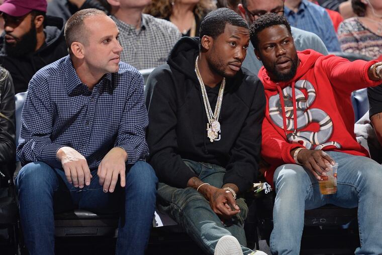 Michael Rubin (left) at a Philadelphia 76ers game with Meek Mill (center) and Kevin Hart.