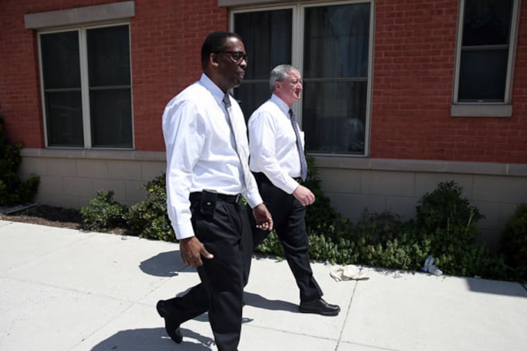 Jim Kenney (back) tours North Philadelphia neighborhoods with Council President Darrell Clarke on May 2, 2015. ( DAVID MAIALETTI / Staff Photographer )