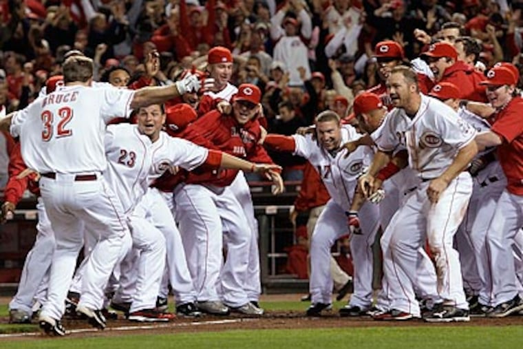The Cincinnati Reds won the NL Central, and will face the Phillies in the Division Series. (Al Behrman/AP)