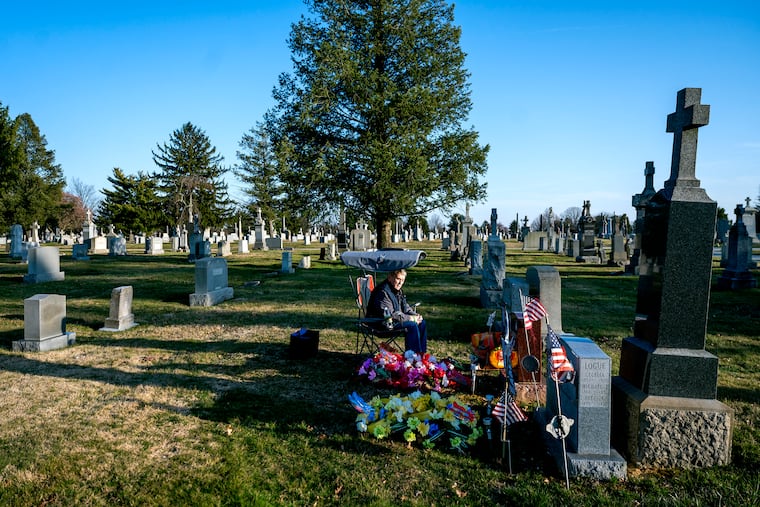 Marty Cabry visits the grave of his daughter, Maryellen, at Holy Cross Cemetery in Yeadon on Monday.