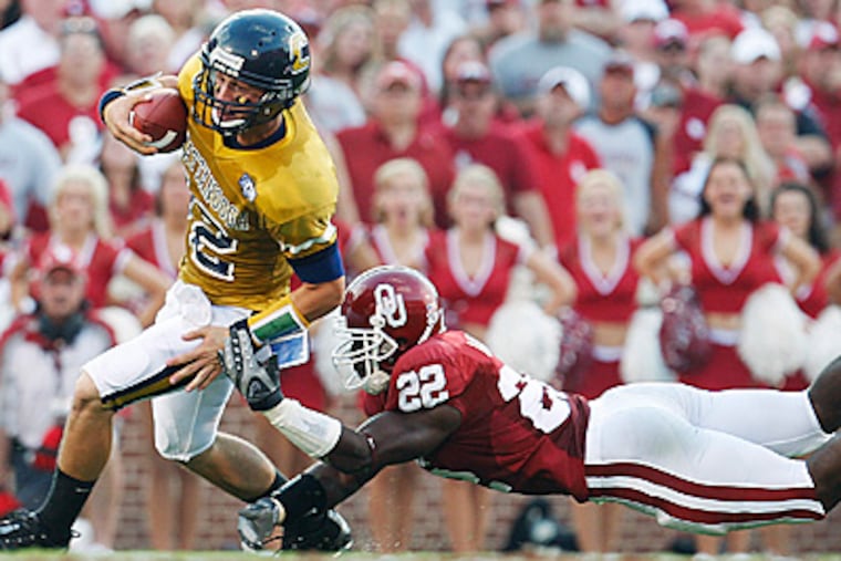 Oklahoma linebacker Keenan Clayton, right, dives to make a tackle. He is hoping to make an impact for the Eagles this season. (AP Photo)