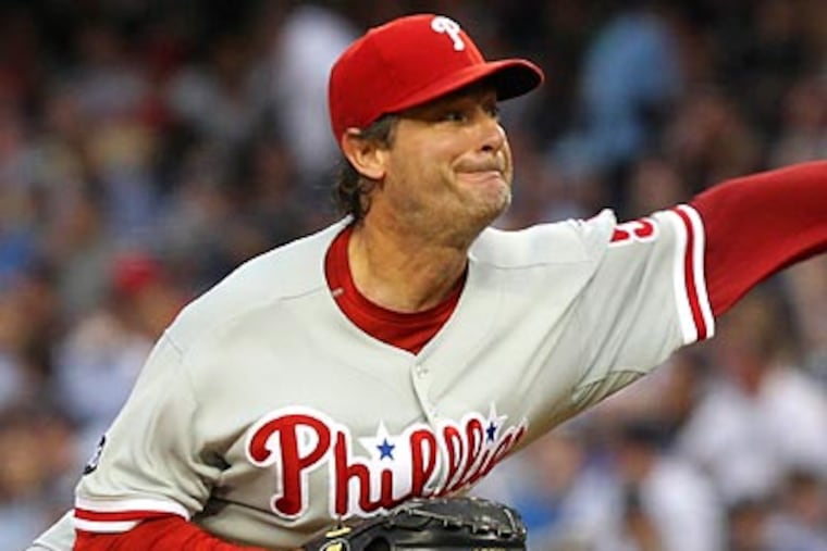 Jamie Moyer has kept the powerful Yankees lineup mostly quiet tonight. (Seth Wenig/AP)