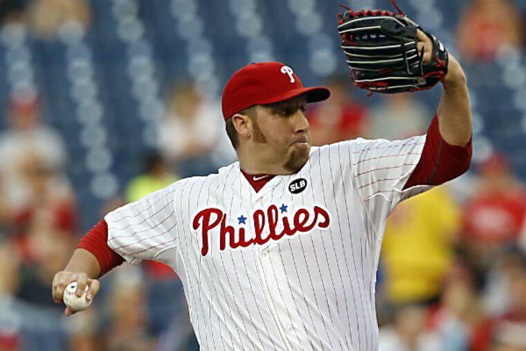 Phillies' pitcher Aaron Harang throws the baseball.