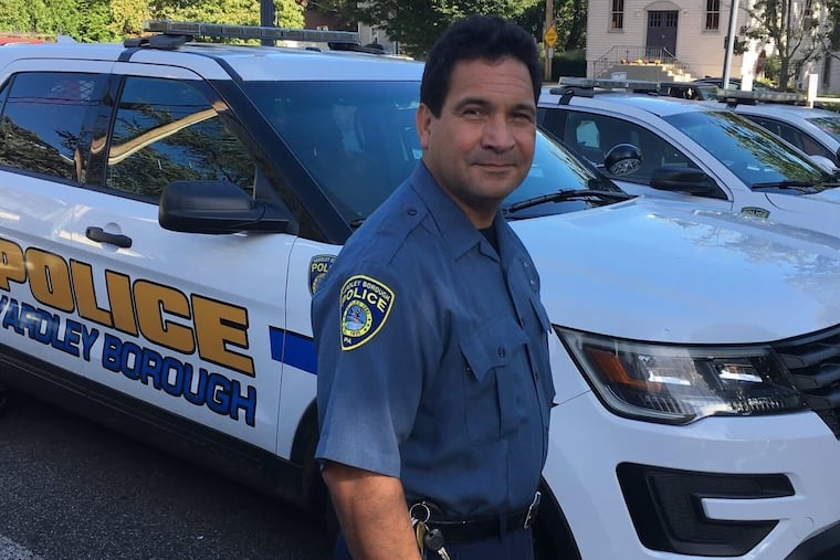 Carlito Cortez, seen here in 2019 while working as an officer in Yardley, pleaded no contest to charges stemming from a love scam he pursued against an elderly woman to gain control of her estate.
