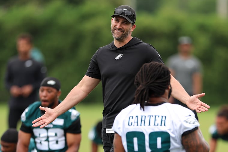 Philadelphia Eagles head coach Nick Sirianni laughs with defensive tackle Jalen Carter during mandatory mini-camp at the Jefferson Health Training Complex on Wednesday, June 10, 2026, in Philadelphia.