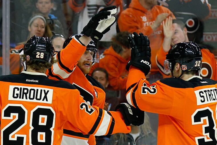 Jakub Voracek celebrates his goal with teammates Claude Giroux and Mark Streit. (Yong Kim/Staff Photographer)