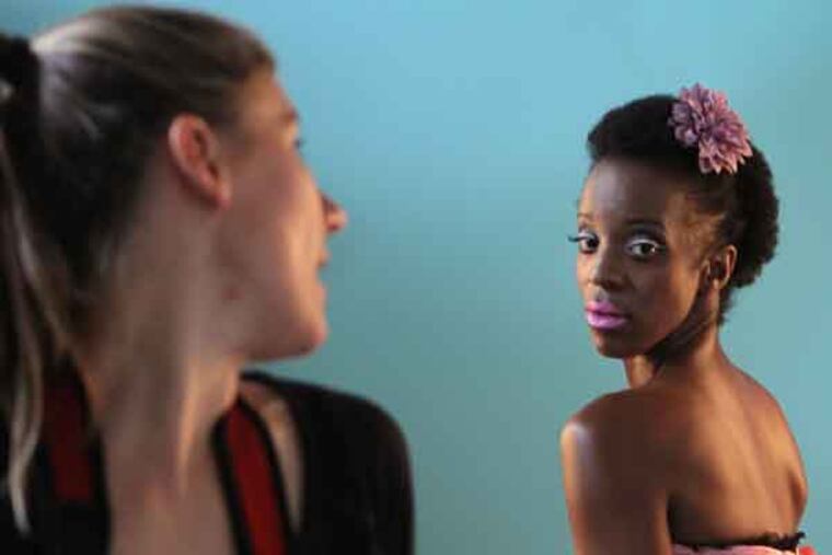 Photographer Tracy Birdsell shows Kelly Devose, a breast cancer survivor, how to pose for Bidsell's Love, Twelve calendar in Mt. Airy Art Garage, in Philadelphia, on Thursday, July 11, 2013. ( Stephanie Aaronson / Staff Photographer )