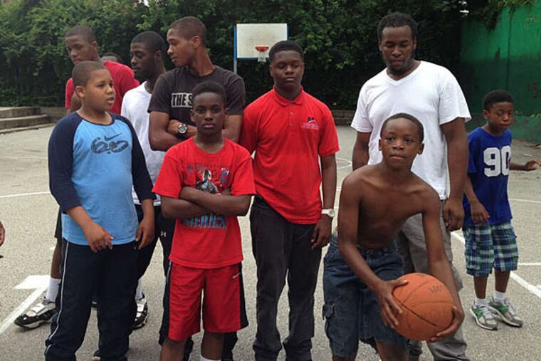 Kids from Heritage Park's basketball league just want to play. (Helen Ubinas/Staff)