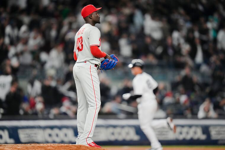 Phillies relief pitcher Yunior Marte looks on as the Yankees' Anthony Rizzo rounds the bases after hitting a two-run home run on Monday.