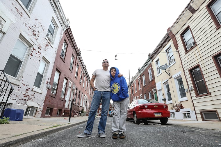 Gilberto Gonzalez and his son in Lower Kensington.
