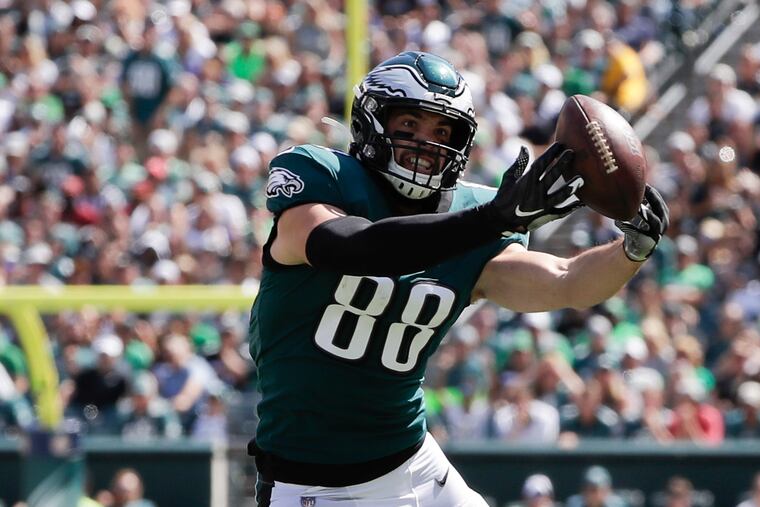 Tight end Dallas Goedert extends his arms for the ball in the Eagles' Week 1 win over Washington. He is out with a calf injury.