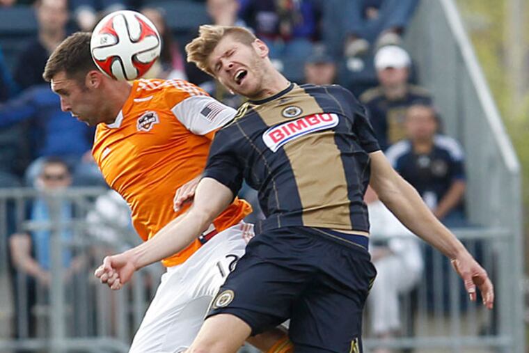 The Union's Aaron Wheeler (right) goes for a header against Houston's Will Bruin. (Ron Cortes/Staff Photographer)