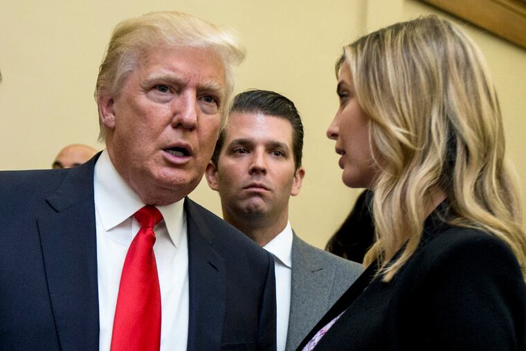 Former President Donald Trump, left, his son Donald Trump Jr., center, and his daughter Ivanka Trump in 2013.