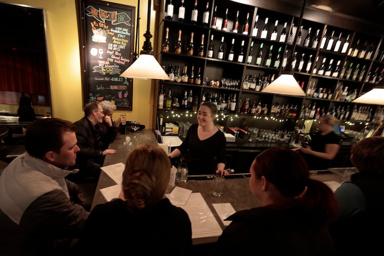 Head bartender Carrie Hice chats with folks at Cooper's Wine Bar in Manayunk this month.