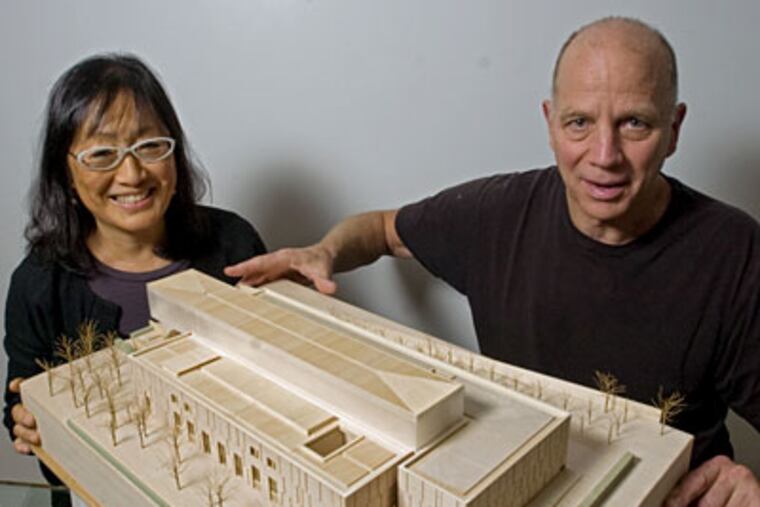 Architects Tod Williams (right) and Billie Tsien show off a model for the new Barnes Foundation on the Parkway in Philadelphia. (Clem Murray / Staff Photographer)